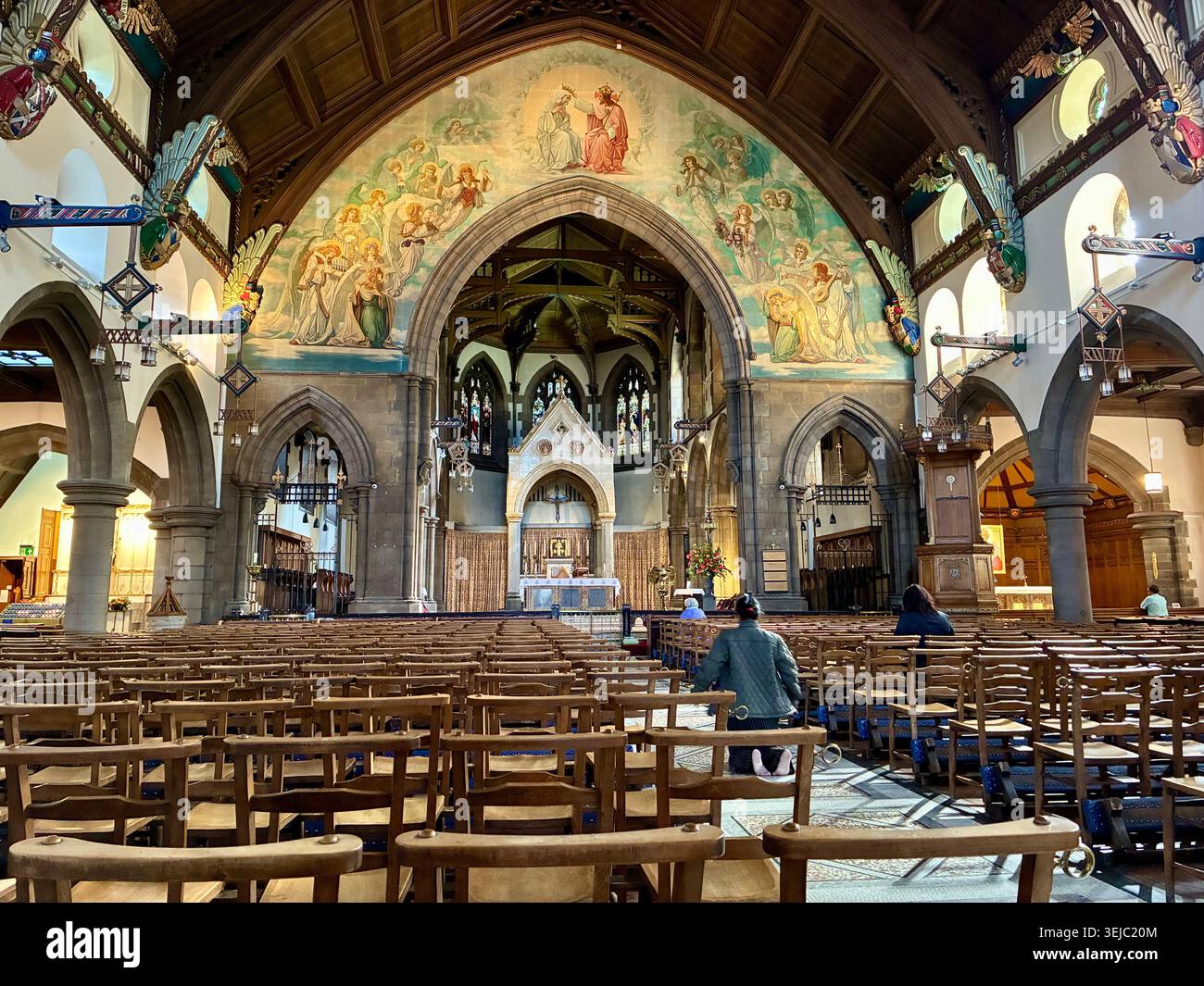 St Mary's Catholic Cathedral in Edinburgh Scotland - interior showing the painted Sanctuary Arch and altar - Smartphone Captured Stock Image
