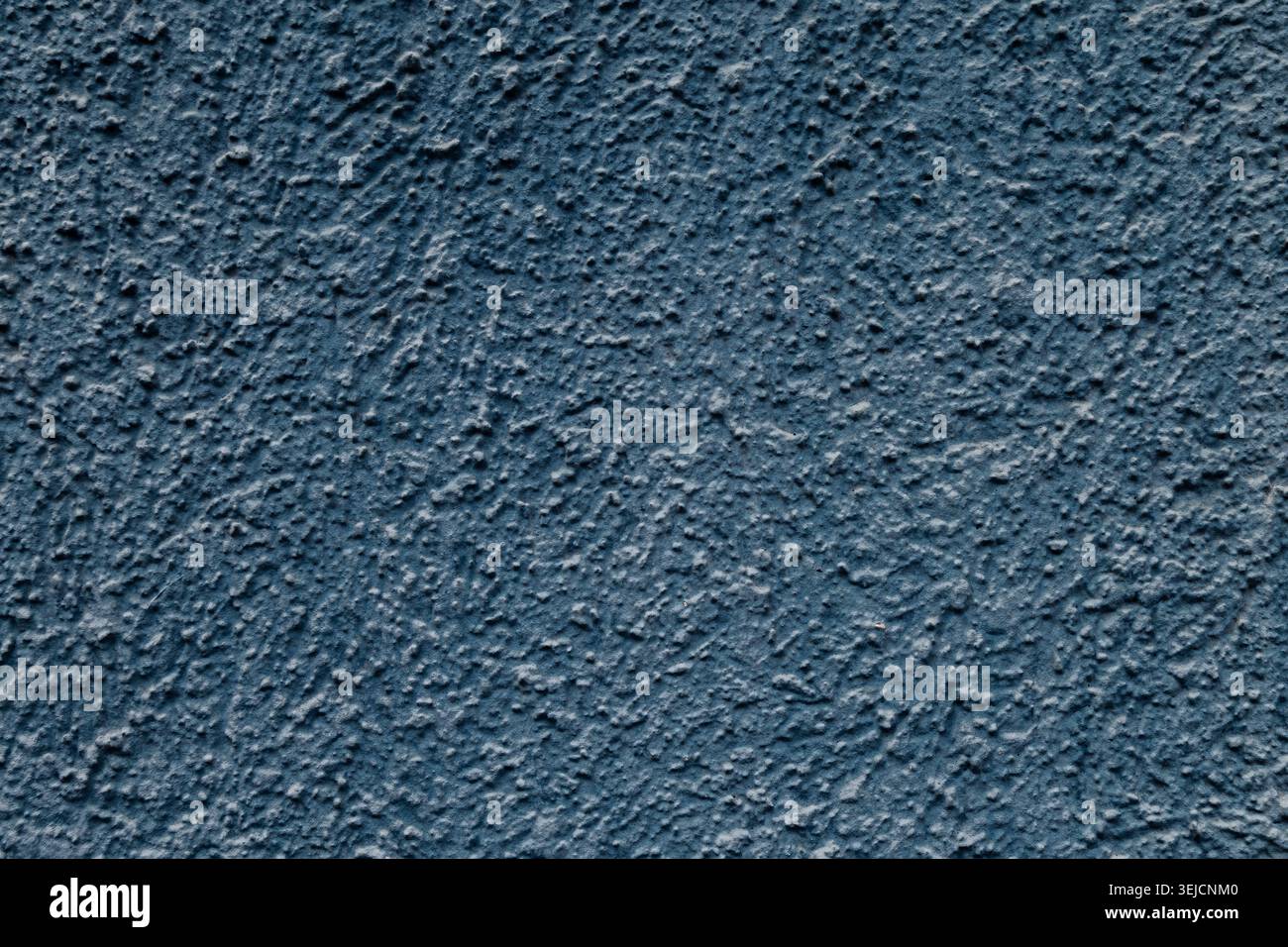 Close Up of Dark Blue Rough Textured Wall Stucco Background Stock Photo