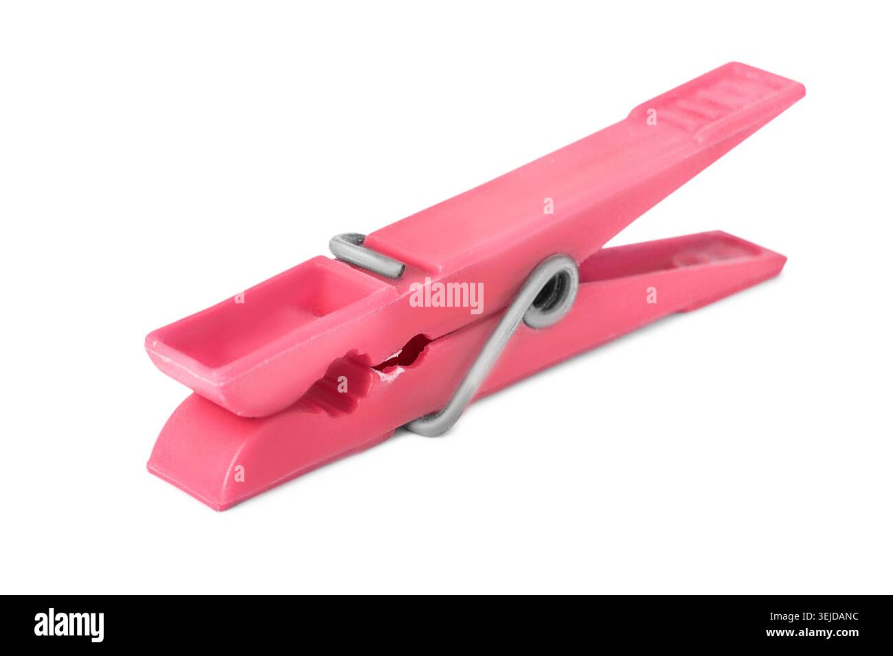 Pink plastic clothespin lying on white background Stock Photo