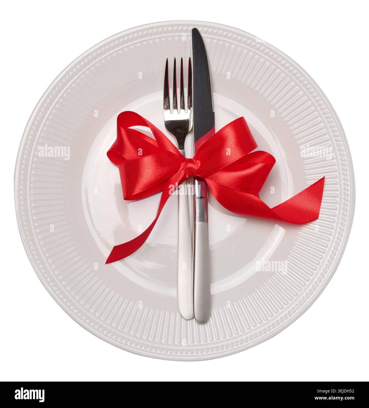 Empty white round plate, fork and knife on isolated background Stock Photo
