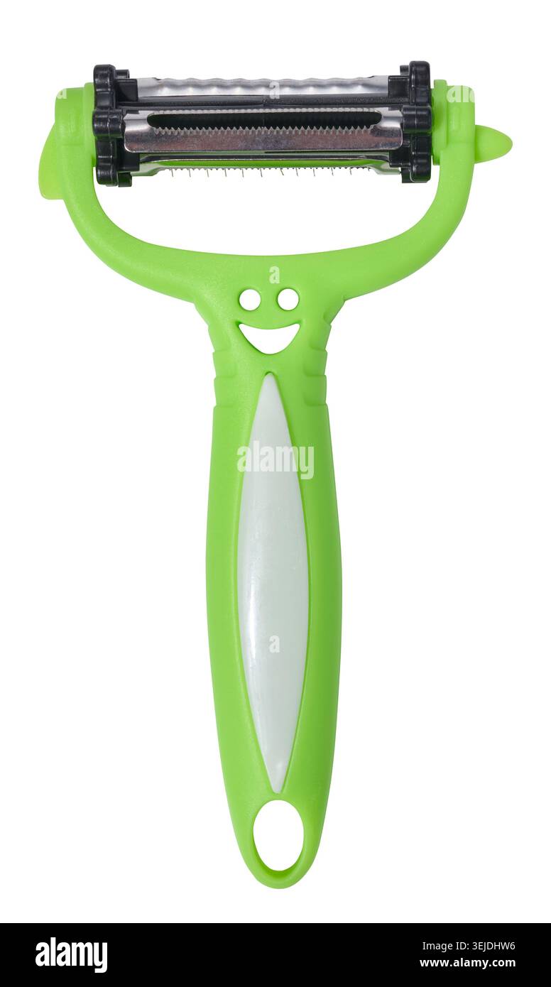Green plastic vegetable peeler on isolated background Stock Photo