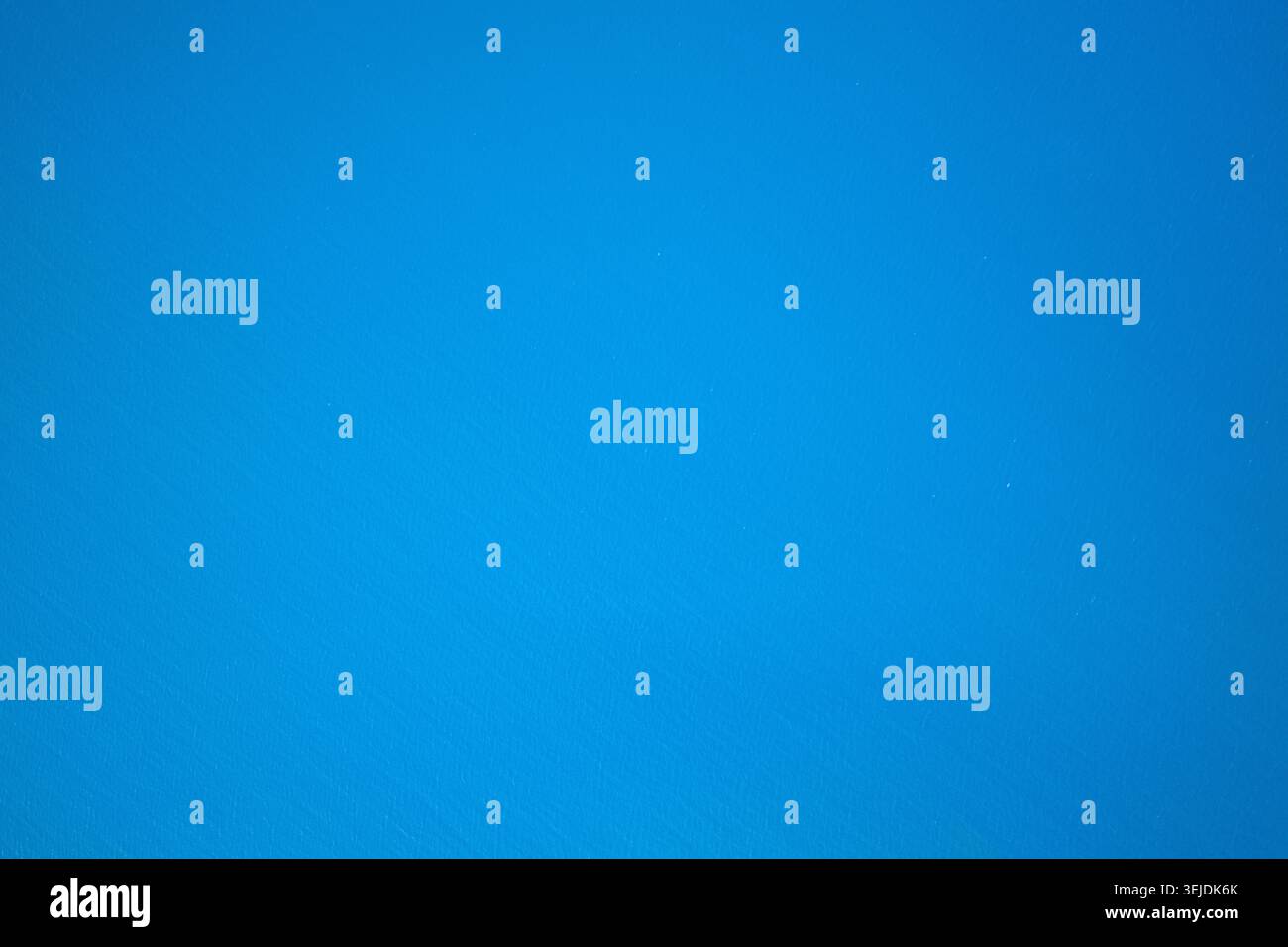 Abstract bright blue textured wall background Stock Photo