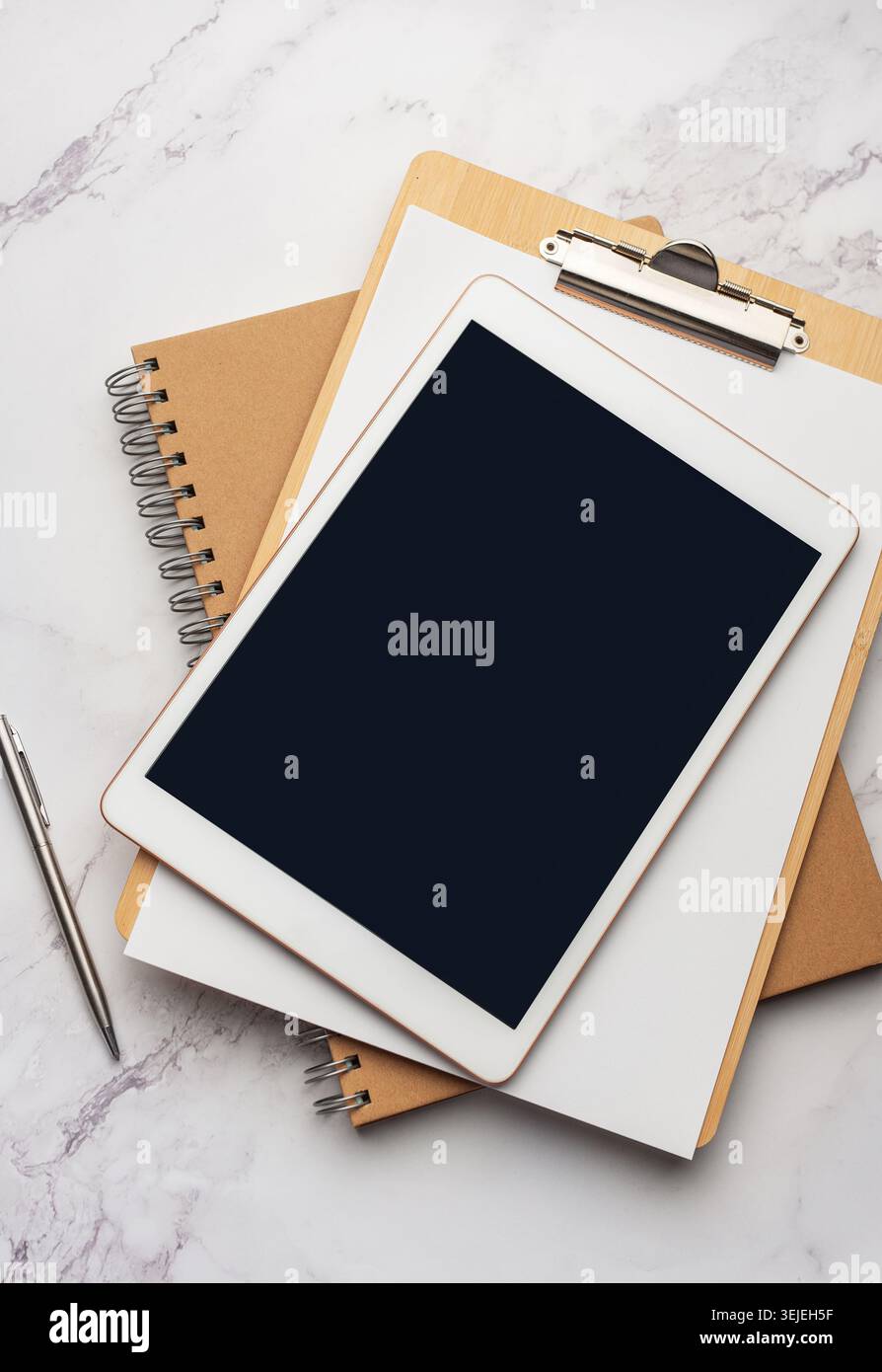 Tablet pc  and notebooks  on the office desk Stock Photo