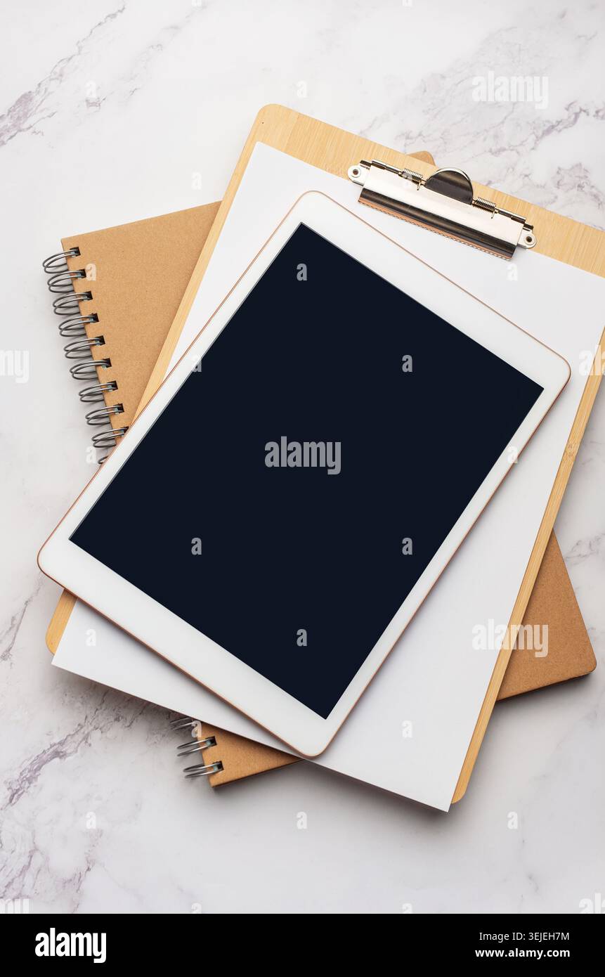 Tablet pc  and notebooks  on the office desk Stock Photo