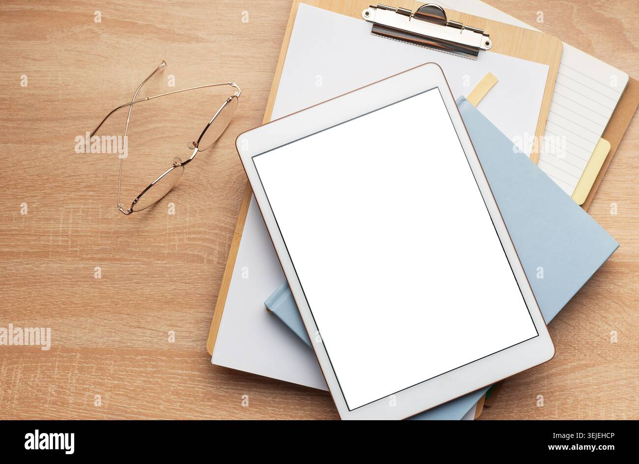 Tablet pc and notebooks on the office desk Stock Photo