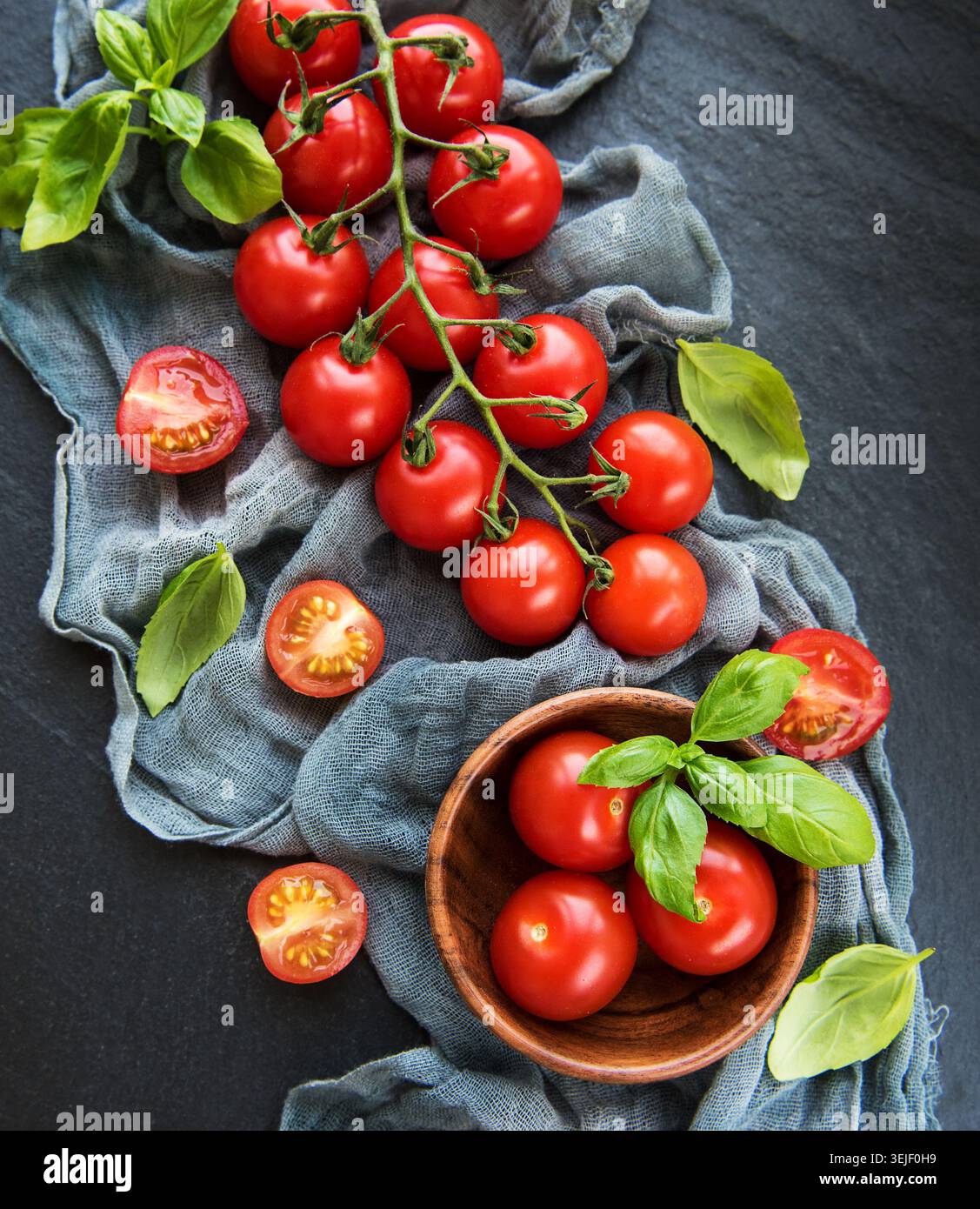 Cherry tomatoes on a black Stock Photo