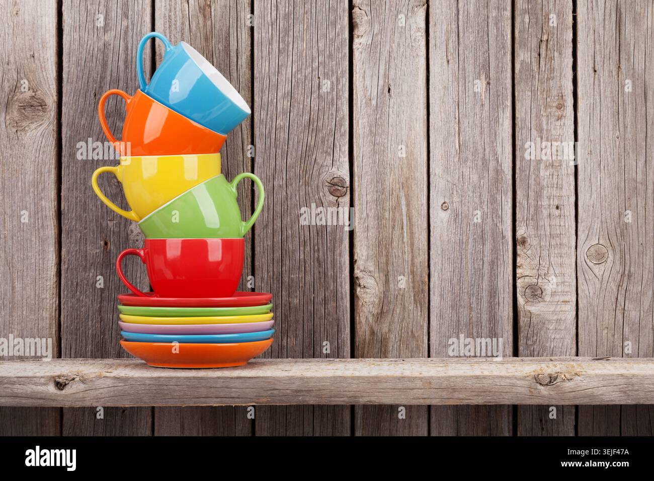 Colorful coffee cups on shelf Stock Photo