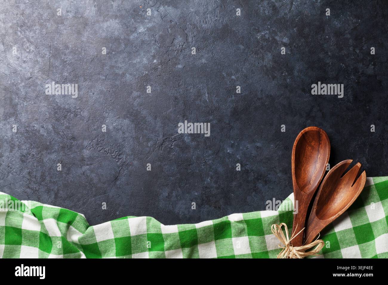 Kitchen table with towel and utensil Stock Photo