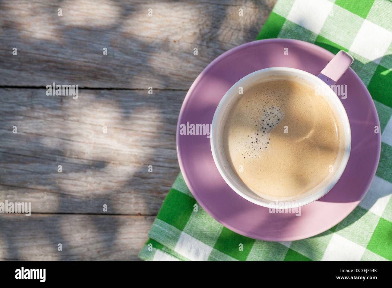 Coffee cup on garden table Stock Photo