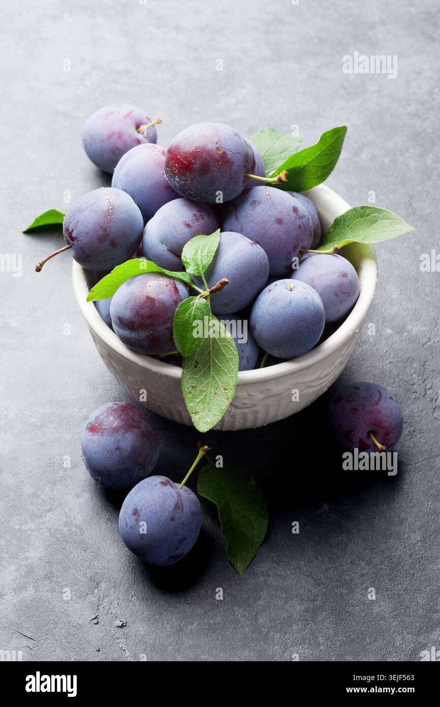Garden plums in bowl Stock Photo