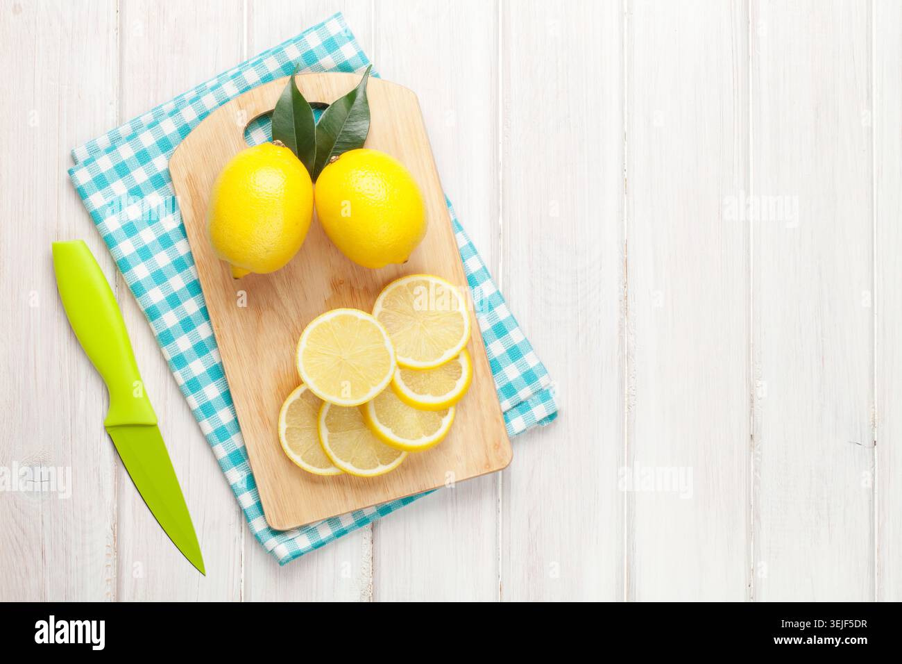 Sliced lemon on cutting board Stock Photo