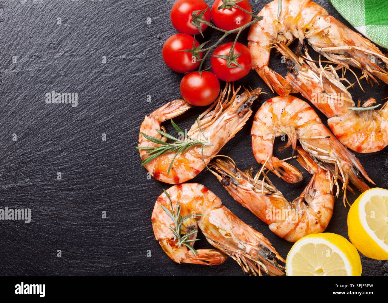 Grilled shrimps on stone plate Stock Photo