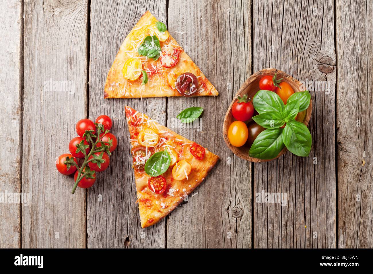 Pizza with tomatoes, mozzarella and basil Stock Photo