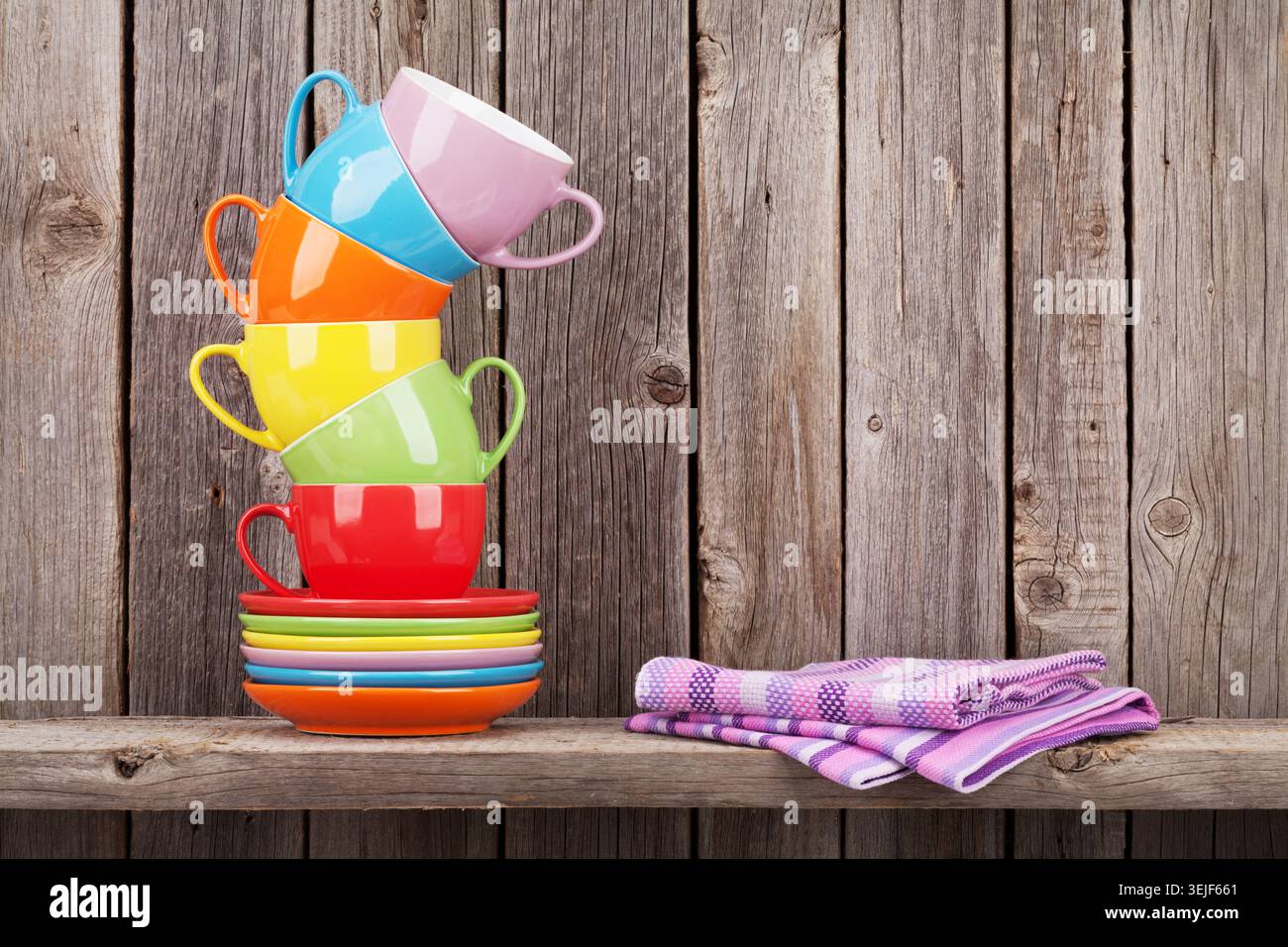 Colorful coffee cups on shelf Stock Photo