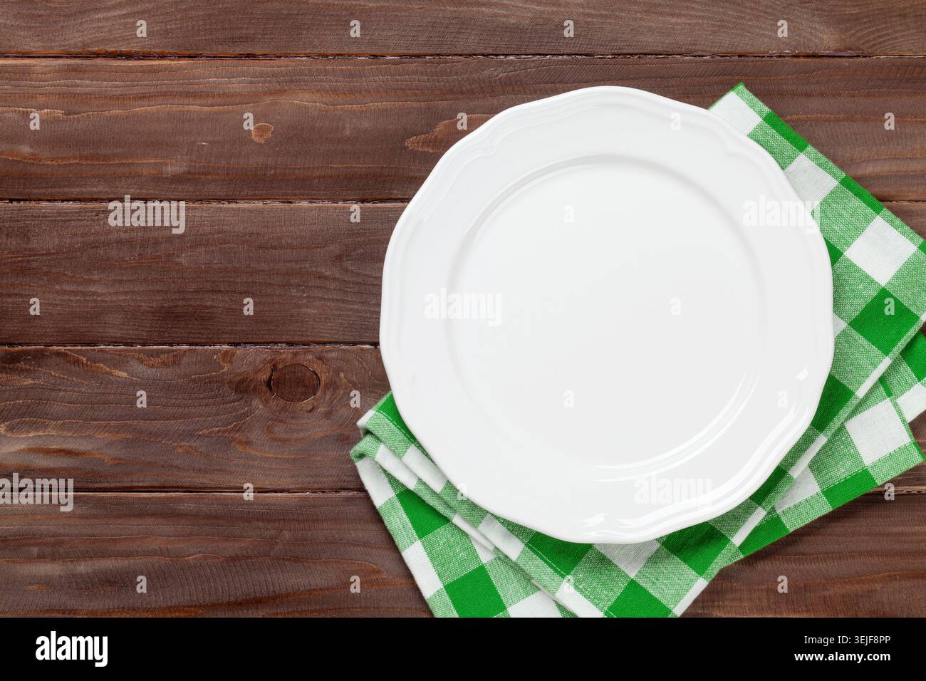Empty plate over wooden table Stock Photo