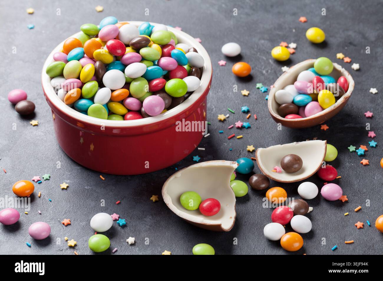 Colorful candies and chocolate egg Stock Photo