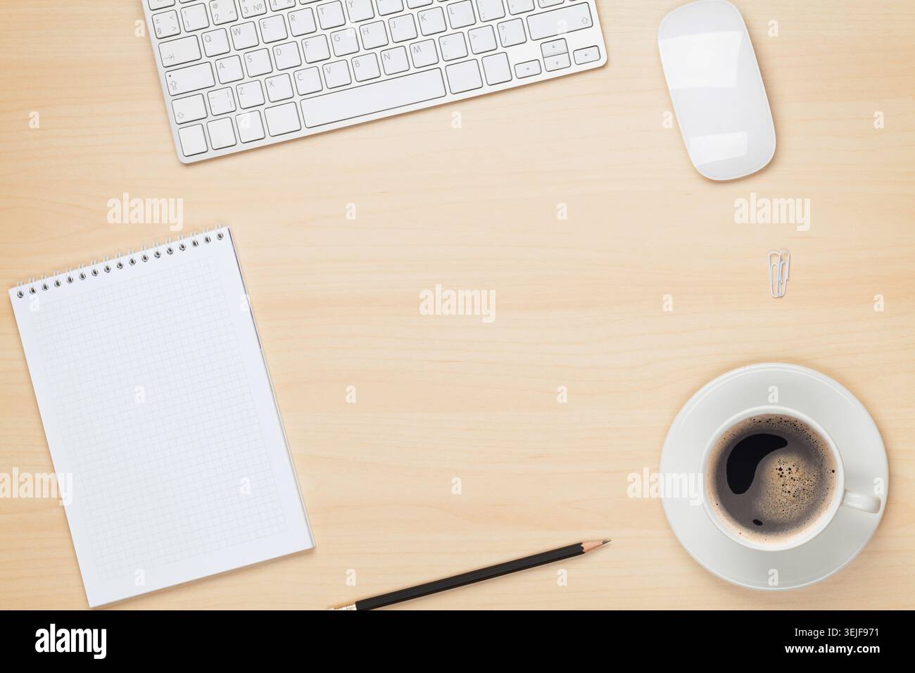 Office table with notepad, computer and coffee cup Stock Photo