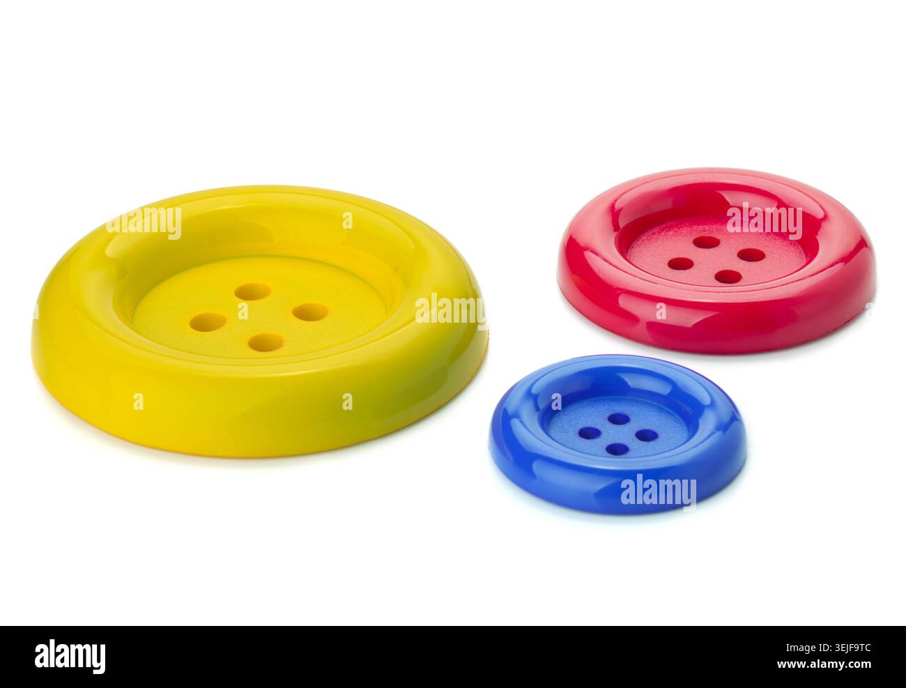 Three colored sewing buttons Stock Photo