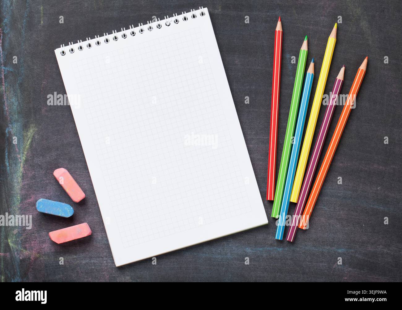 School supplies on blackboard background Stock Photo