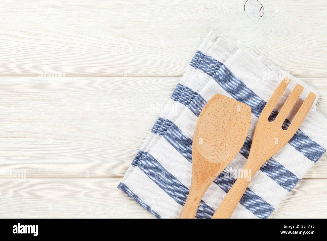 Kitchen utensil over white wooden table Stock Photo