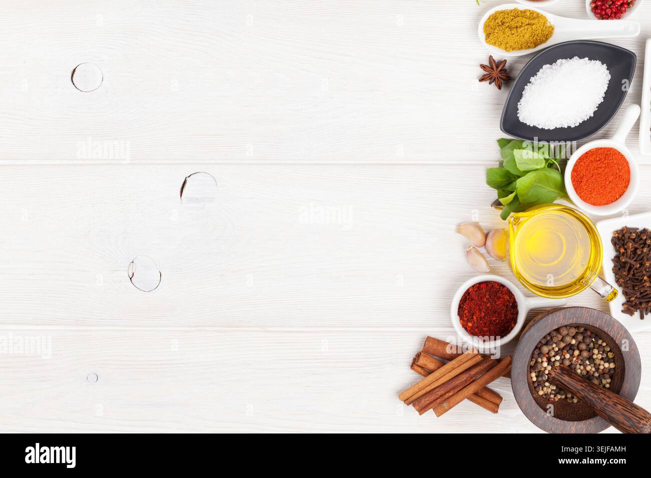 Various spices on white wooden background Stock Photo