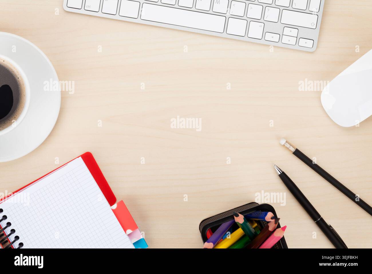 Office table with computer, supplies and coffee cup Stock Photo