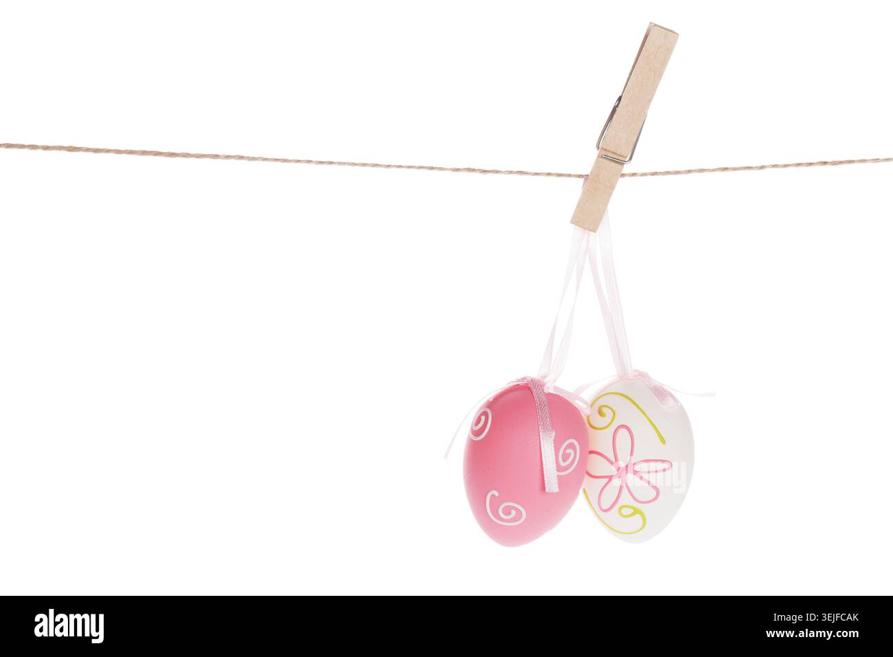 Colorful easter eggs hanging on rope Stock Photo