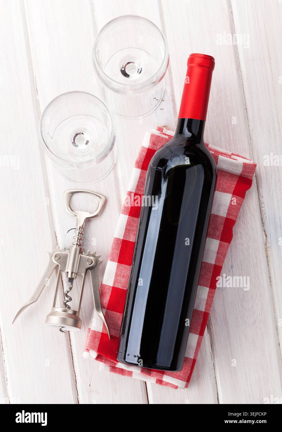Red wine bottle, glasses and corkscrew Stock Photo