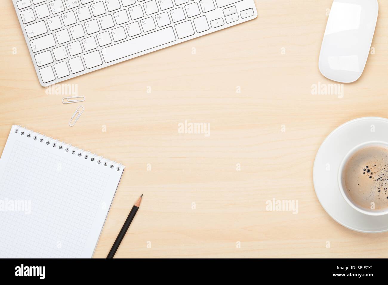 Office table with notepad, computer and coffee cup Stock Photo