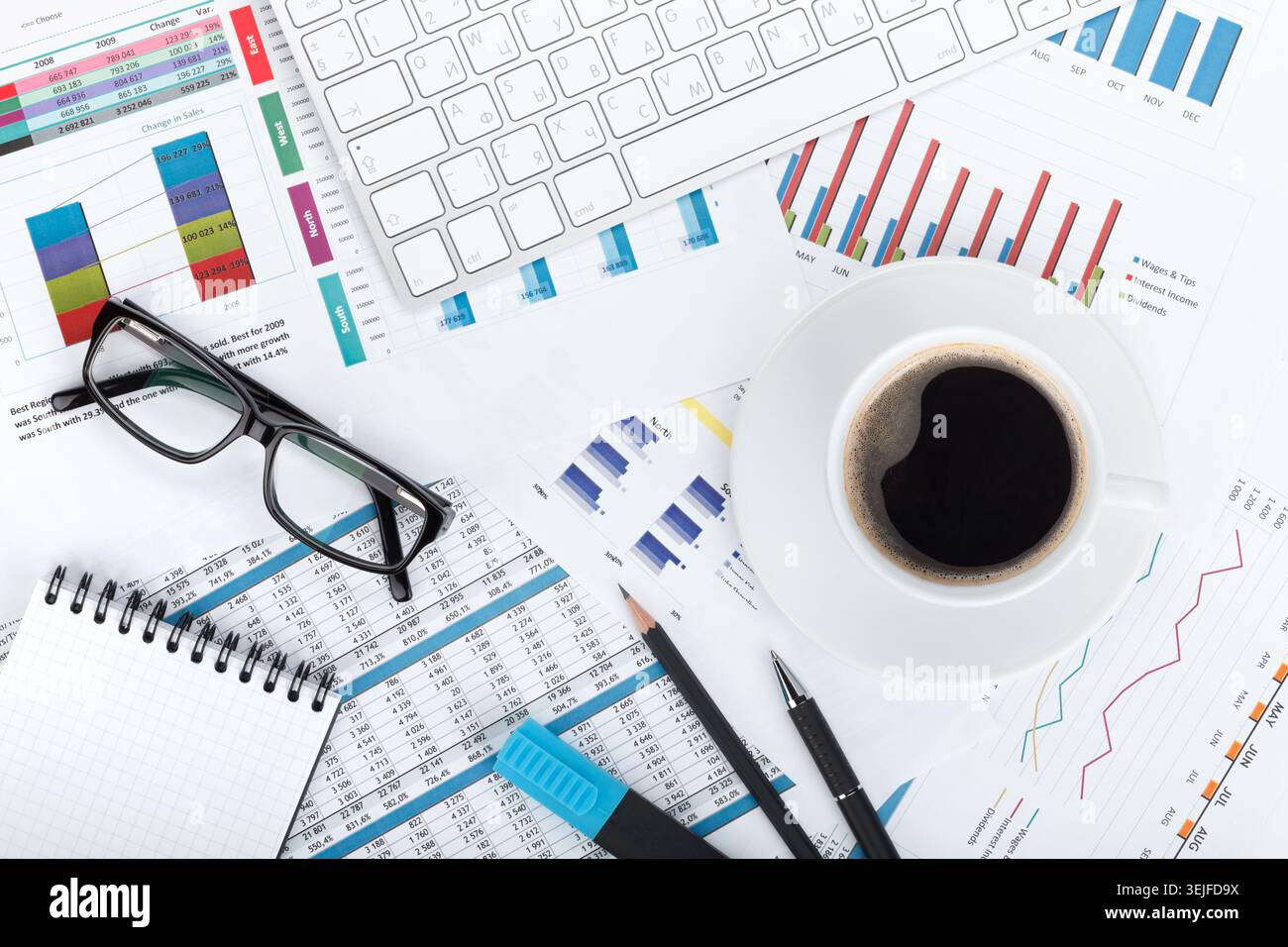Coffee cup on financial papers Stock Photo