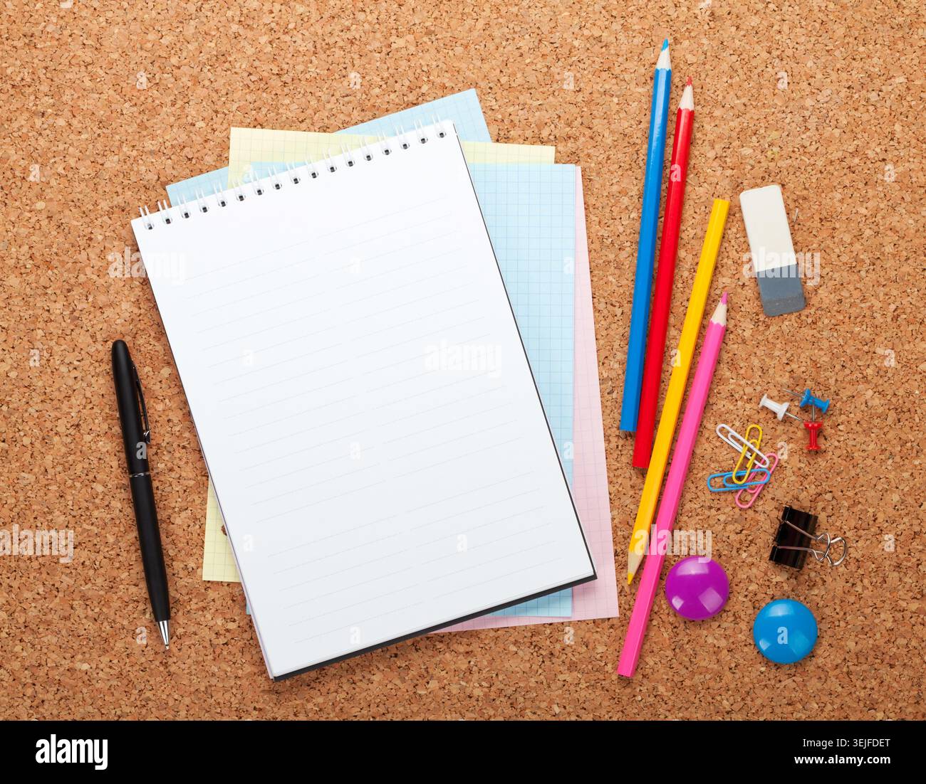 Blank notepad on cork notice board Stock Photo