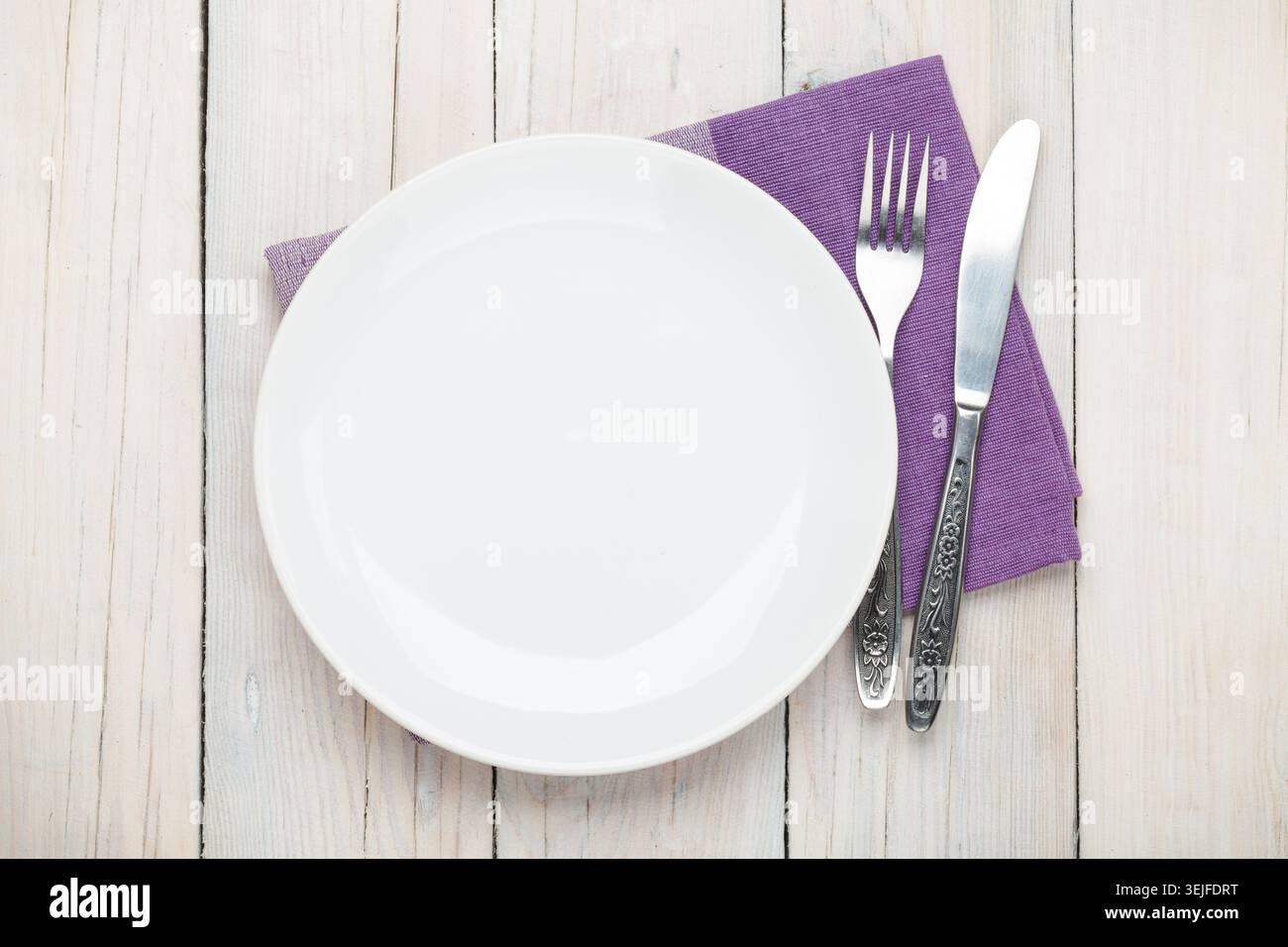 Empty plate and silverware Stock Photo