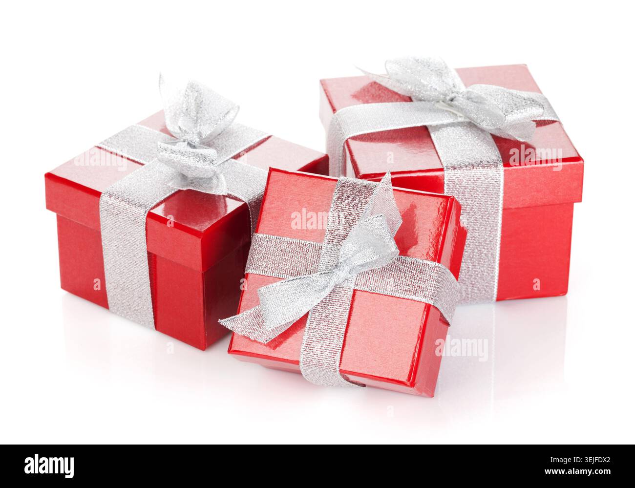 Three red gift boxes with silver ribbon and bow Stock Photo