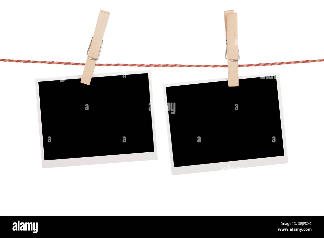 Blank photos hanging on clothesline Stock Photo