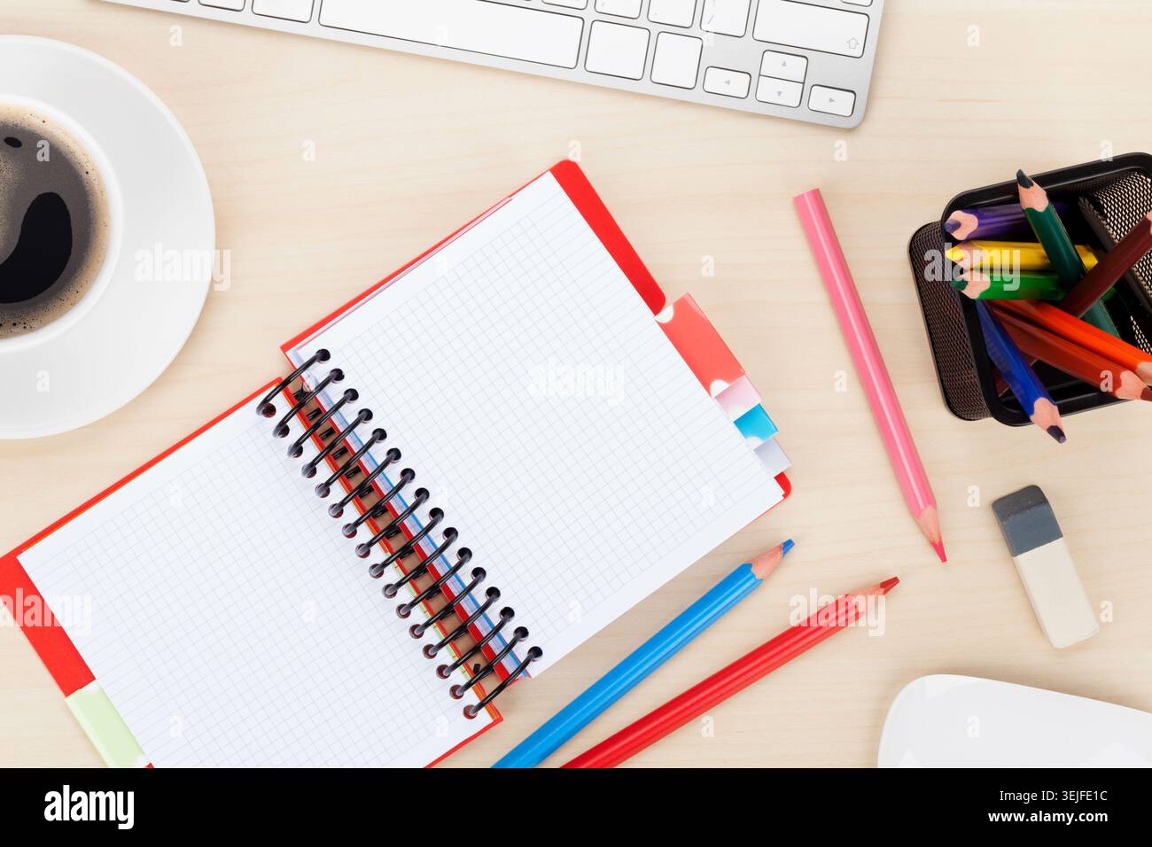 Office table with computer, supplies and coffee cup Stock Photo