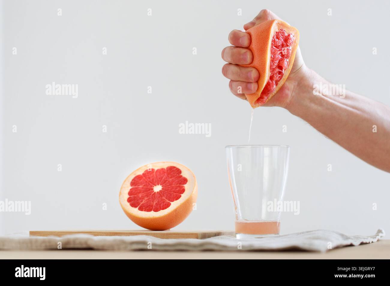 Hand squeezed grapefruit juice Stock Photo