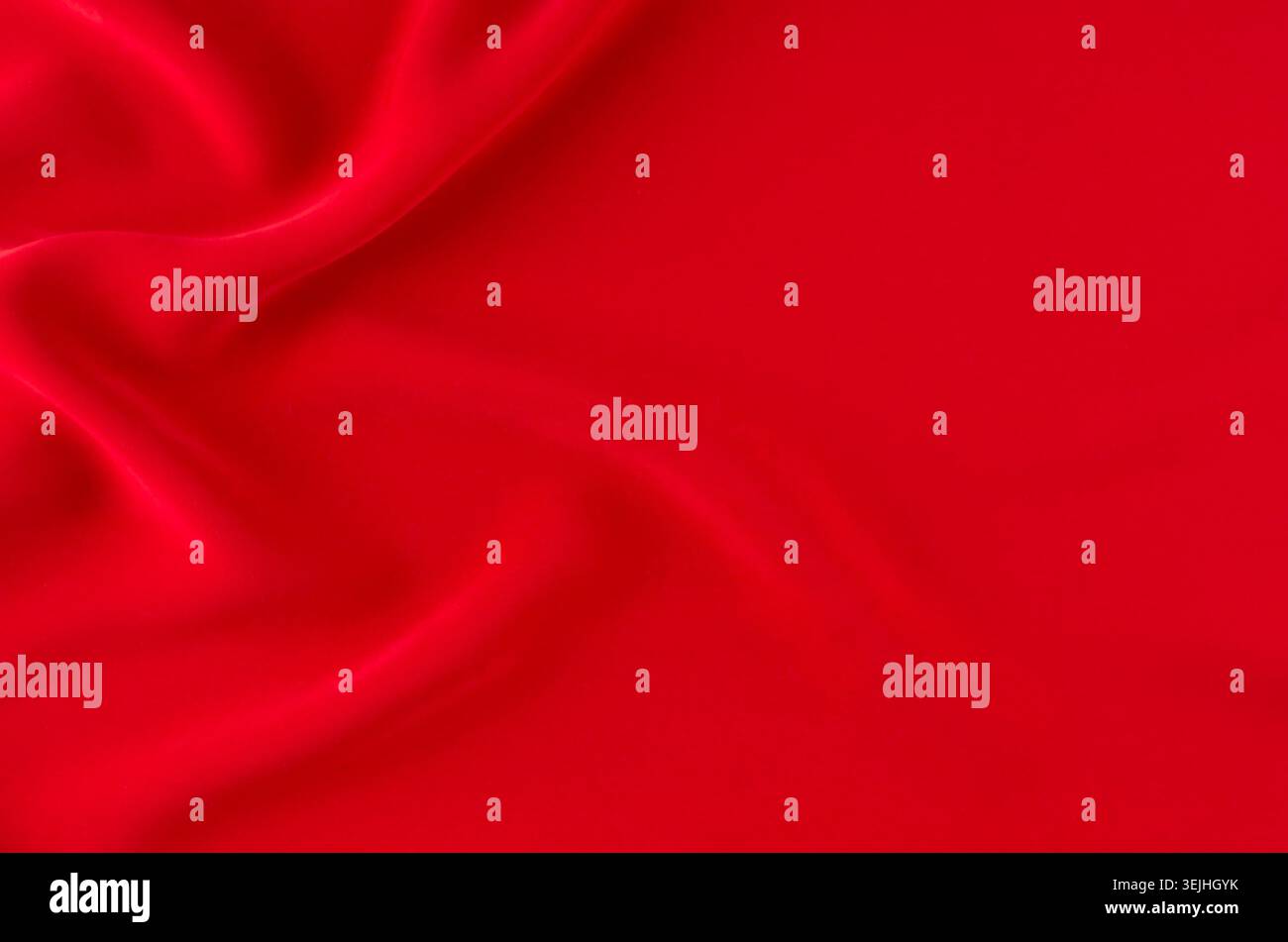 Deep red silk smooth wavy background with copy space. Stock Photo