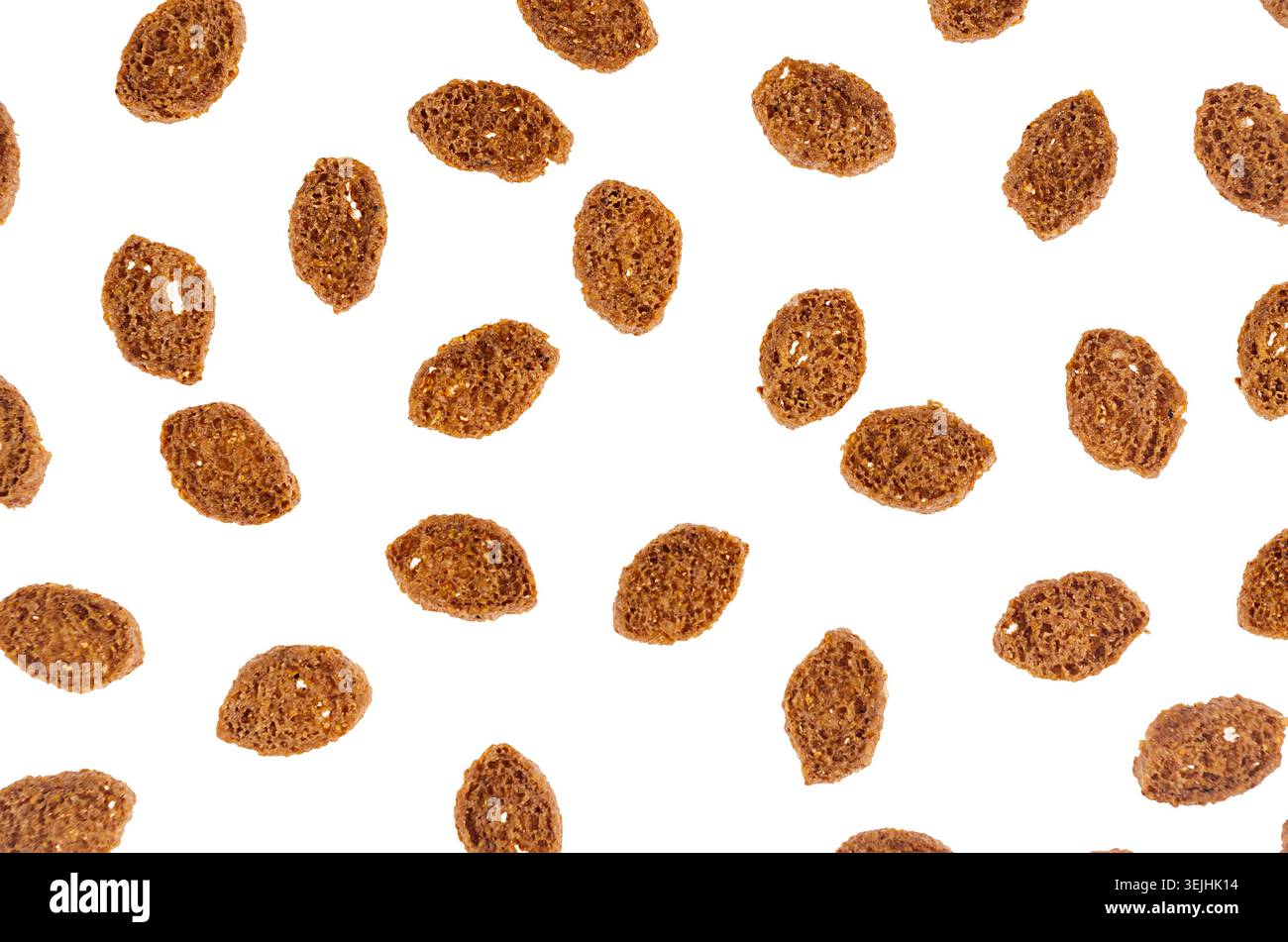 Brown slices rye croutons isolated on white background, top view, pattern. Stock Photo