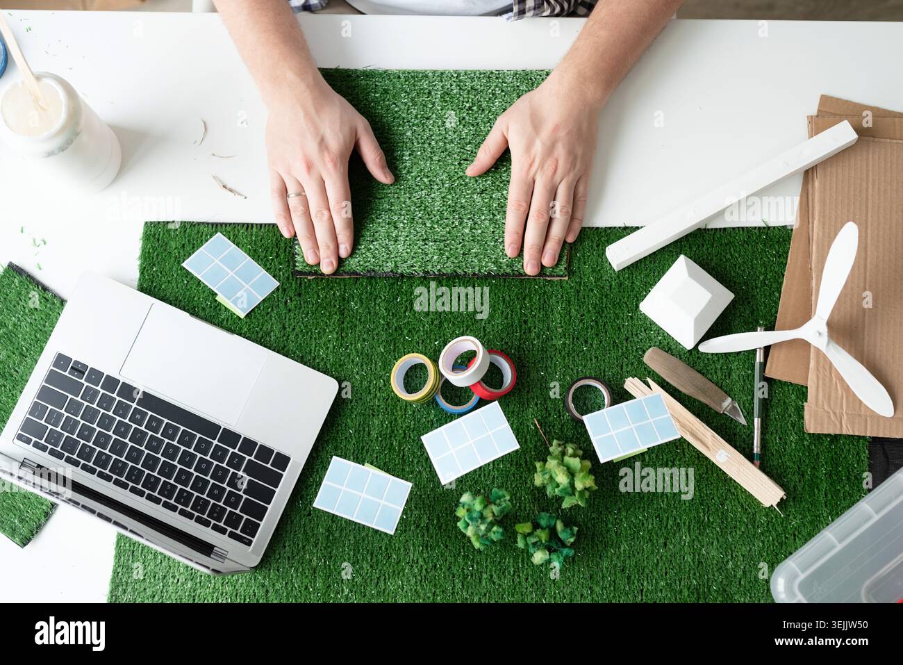 Young man teaching online making renewable energy dummy Stock Photo