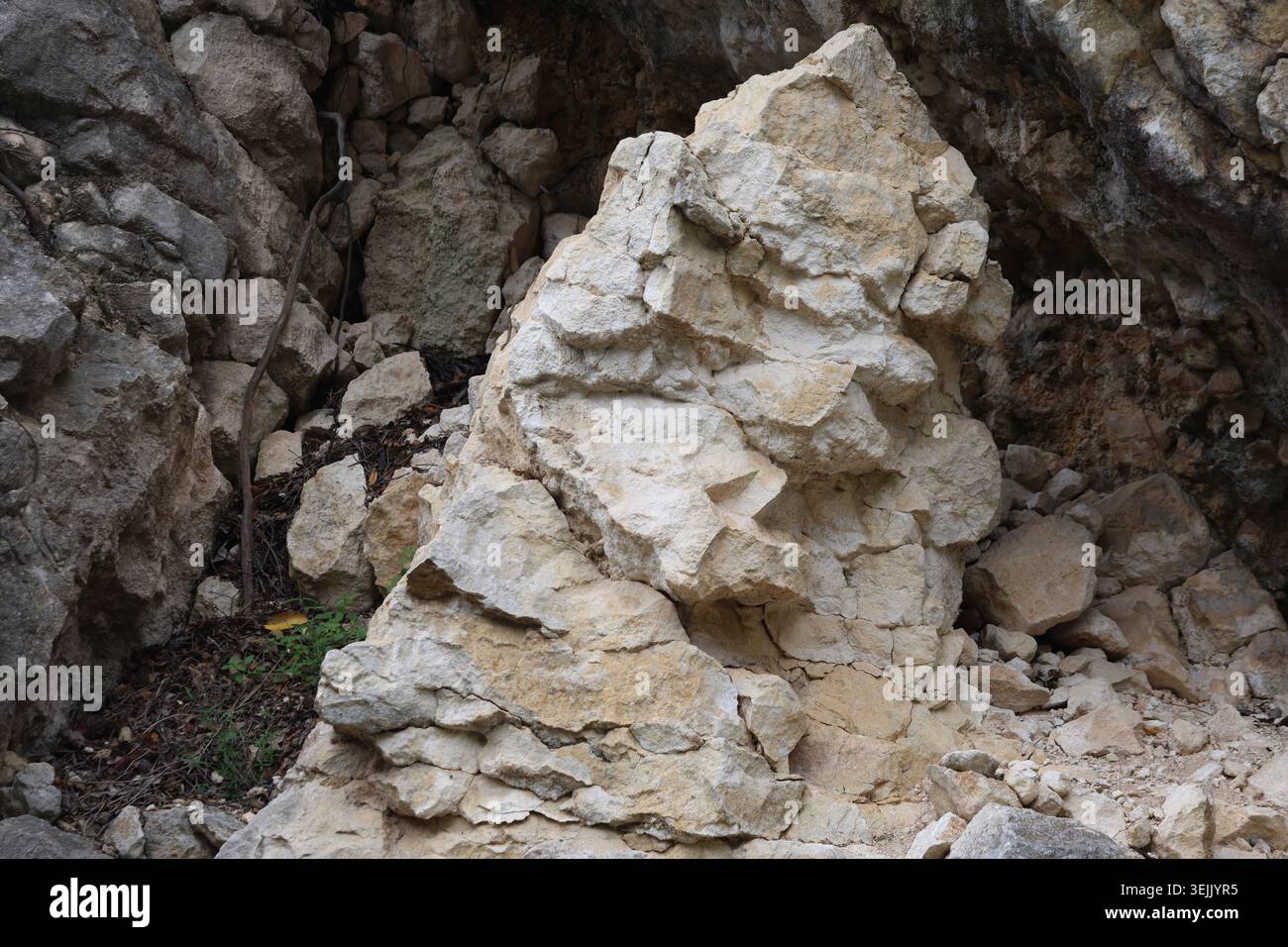 Natural Textured Limestone Rock Surface with Fractures and Angular Cracks Stock Photo