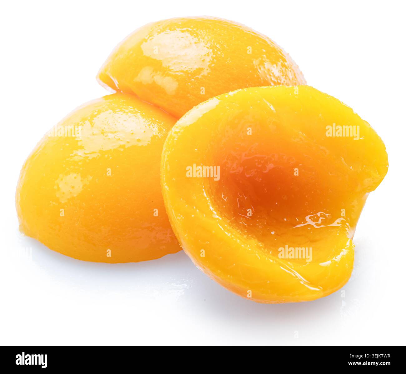 Peeled canned peach halves isolated on white background. File contains clipping paths. Stock Photo