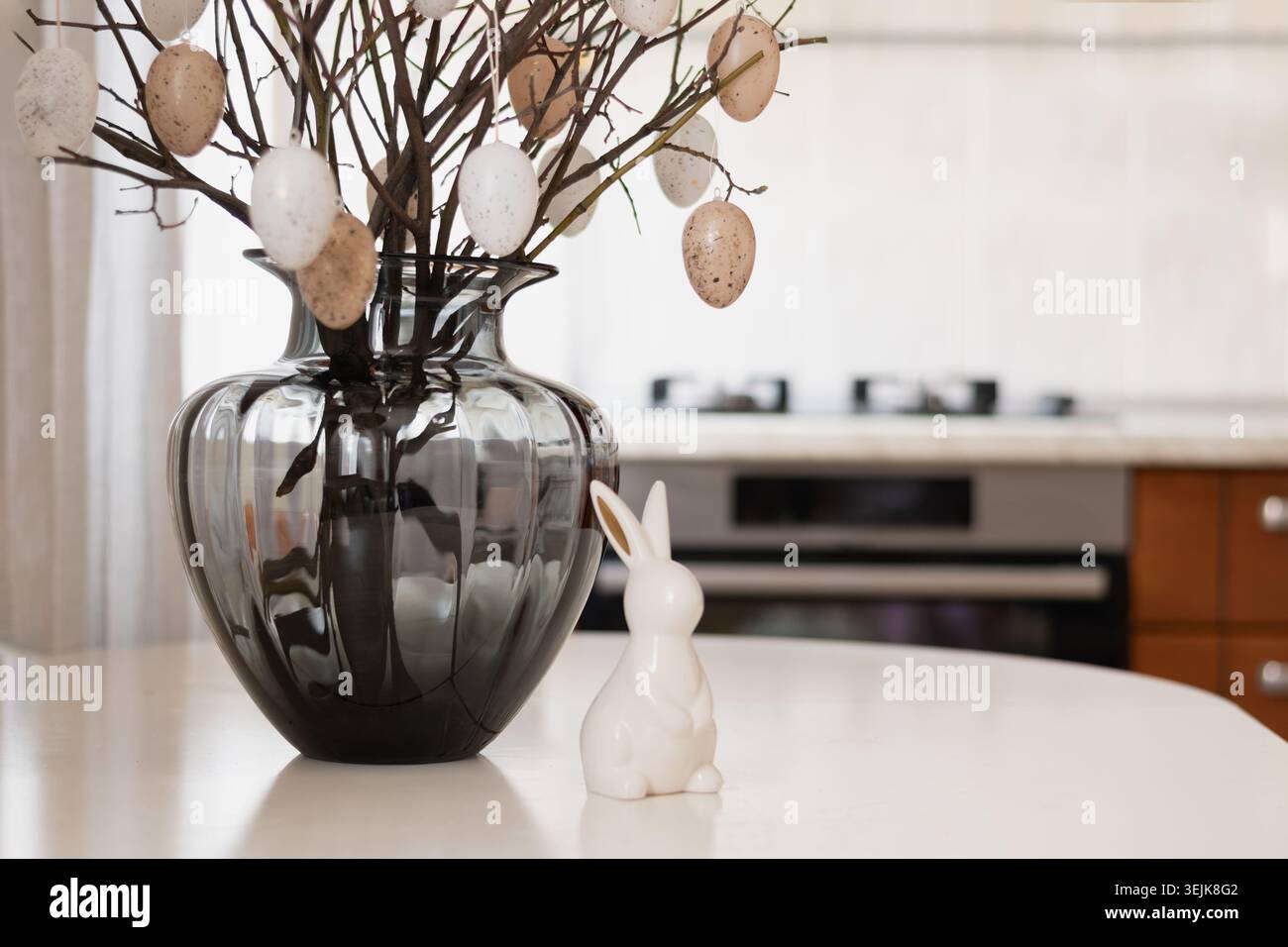 Easter branches with eggs and bunny figurine Stock Photo