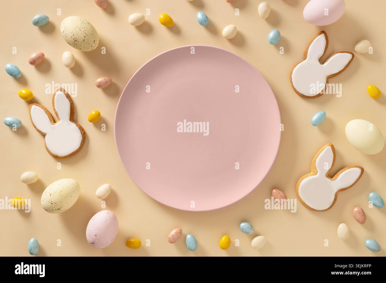 Easter bunny cookies on beige background. Top view. Stock Photo