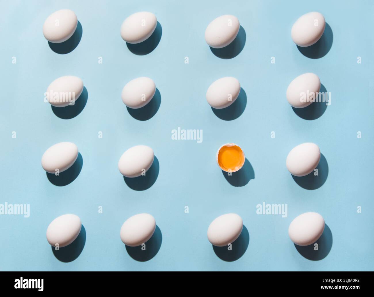 Organic white eggs on blue. Abstract pattern. Eggs in isometric. Stock Photo