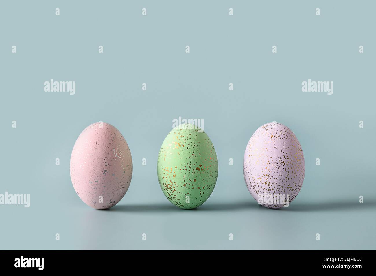 Three violet decorative pastel eggs. Happy Easter greeting card Stock Photo