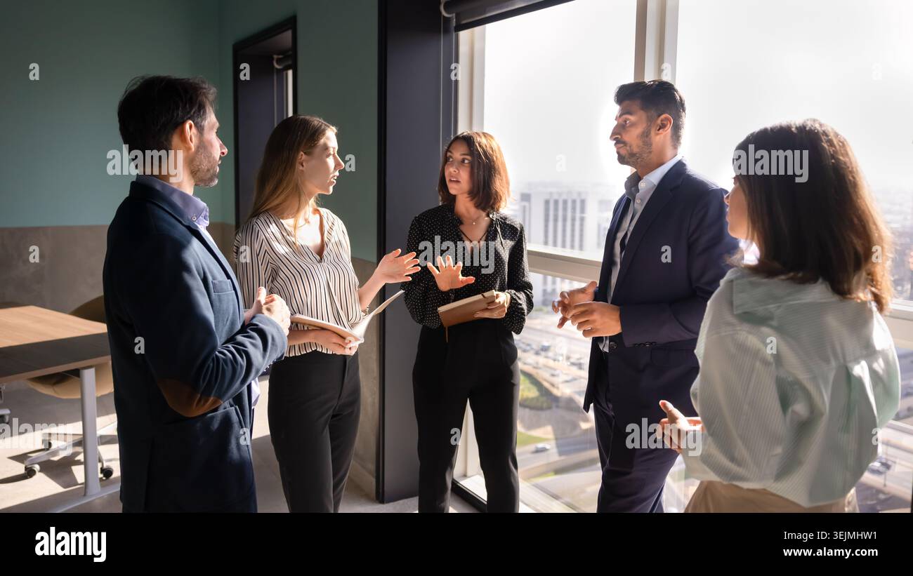 Multiethnic business group discussing strategy during meeting in office Stock Photo