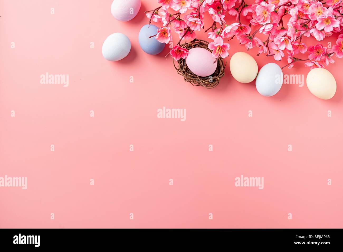 Easter holiday background with decorations on pink backdrop Stock Photo