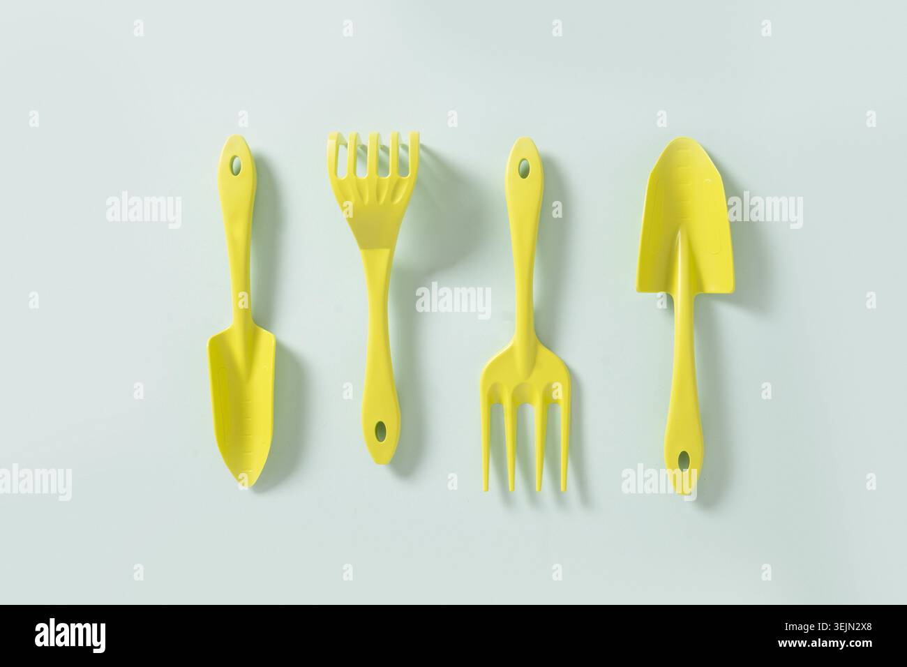 Various gardening Hand tools on blue background. Top view. Stock Photo