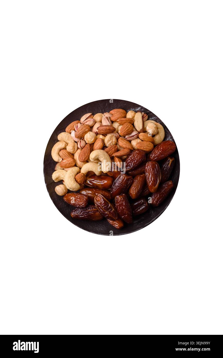 Dried dates on a ceramic plate for Ramadan or Iftar. Dates fruit as a background Stock Photo