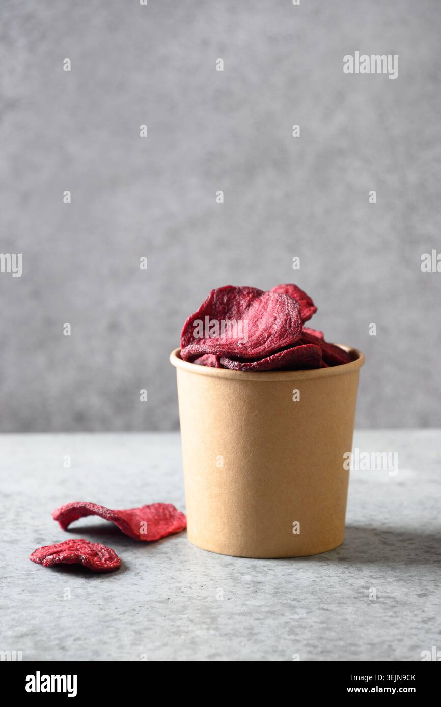 Vegetable beetroot vegan chips in craft box. Stock Photo